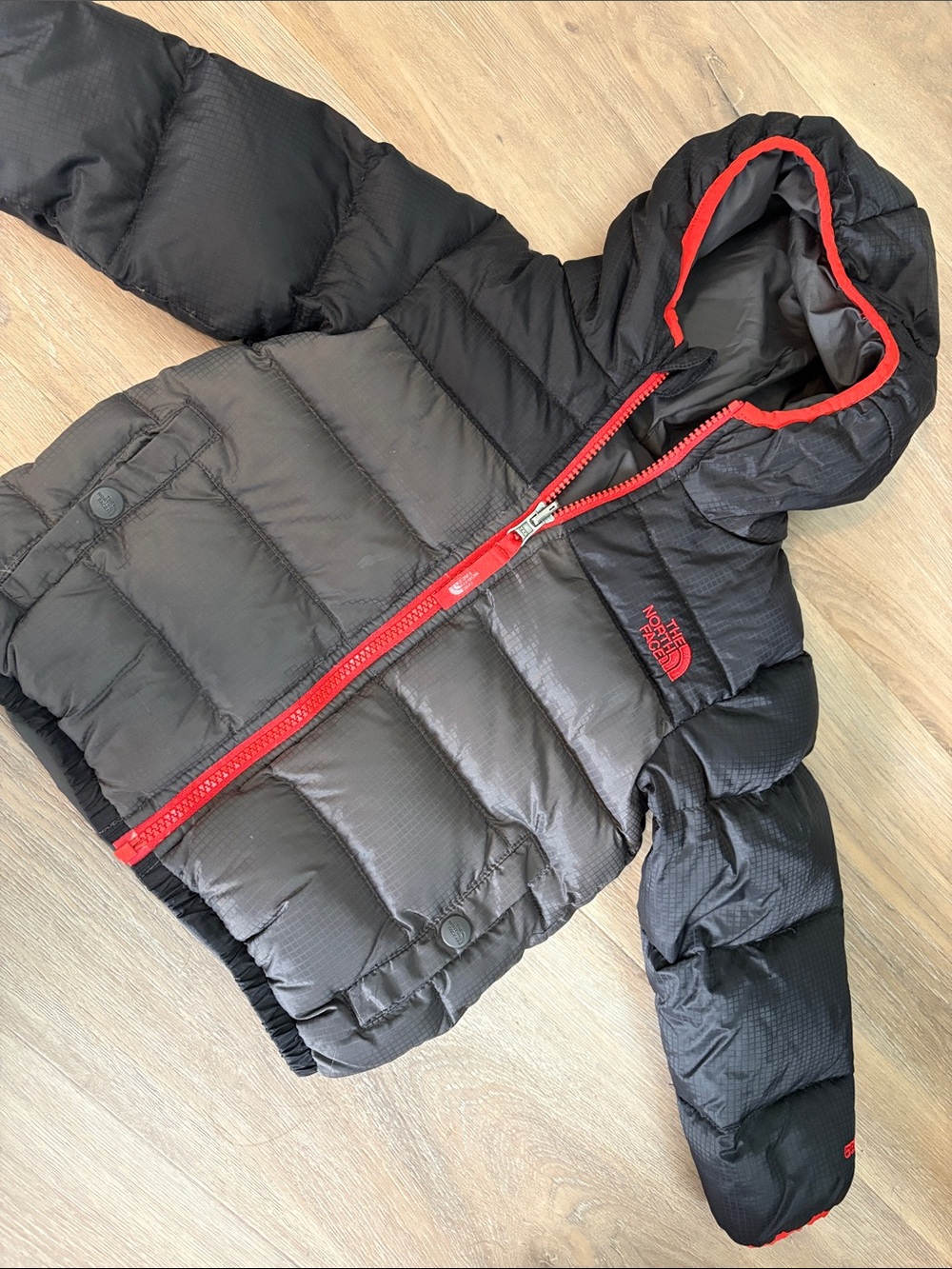 The North Face Kids Reversible Black/Gray Puffer Jacket with Red Trim